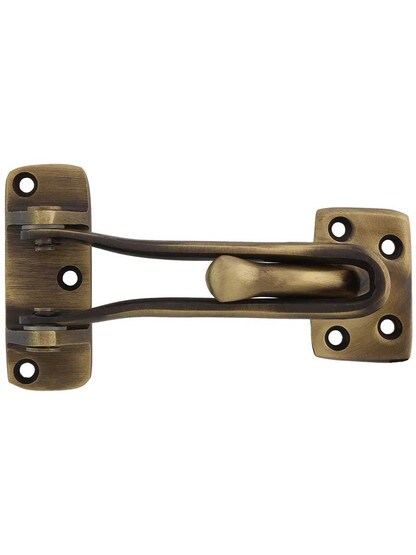 4 inch Swing-Arm Door Guard in Antique Brass.
